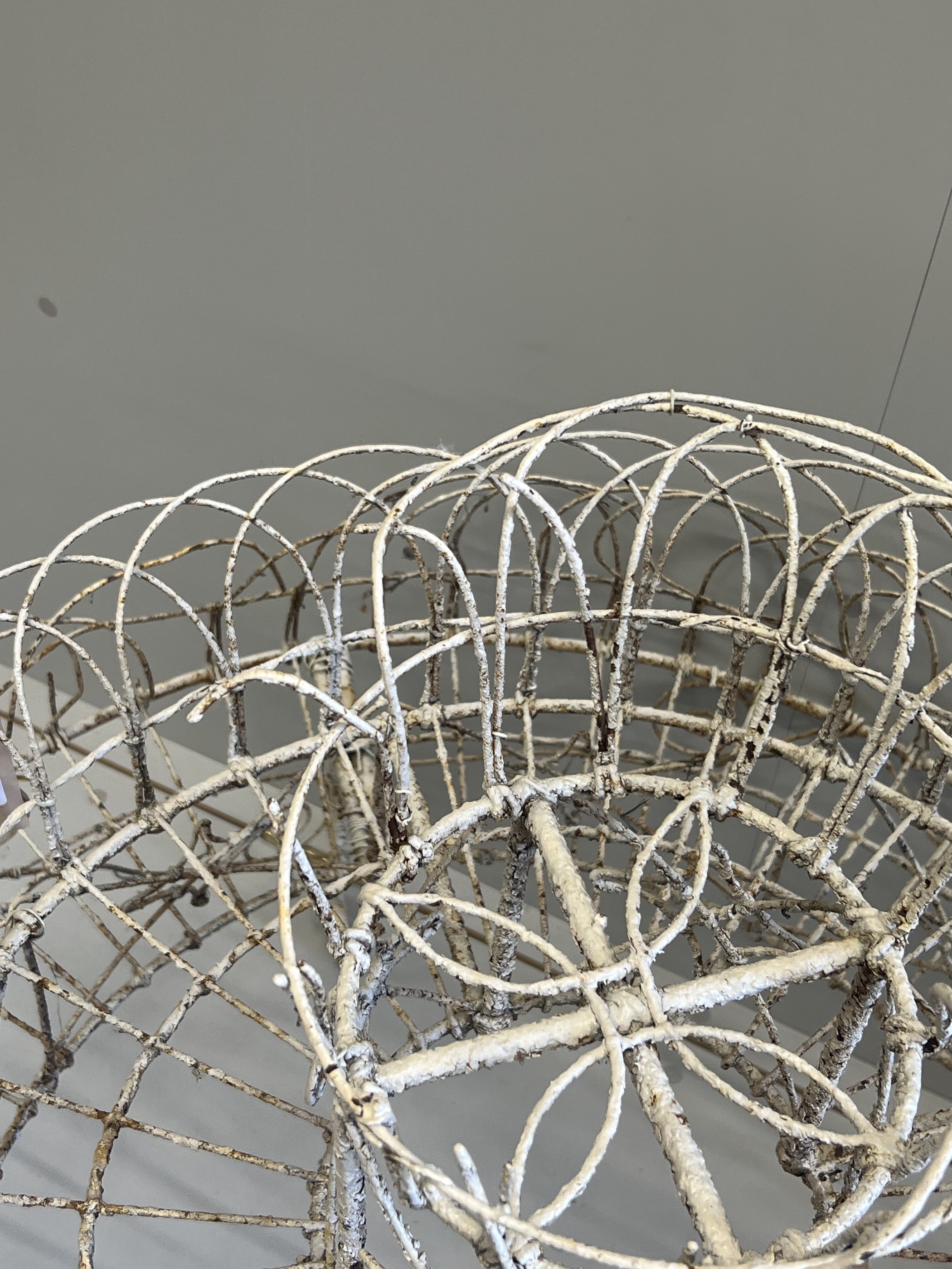 A Victorian painted wirework circular three tier pot stand, diameter 94cm, height 81cm